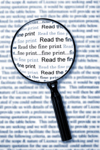 Reading fine print with a magnifying glass
